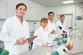 Group portrait of smiling scientists