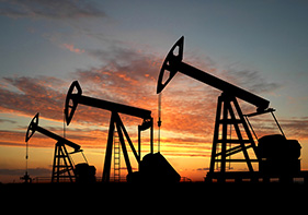 Silicone products for Oil and Gas - Silhouette of three oil pumps in the sunset